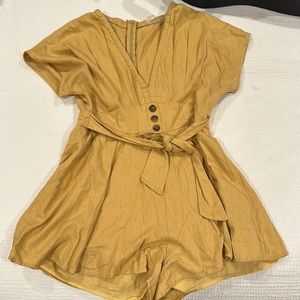 Cute romper from Anthropologie. Muted mustard color size L